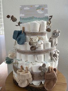 a diaper cake is stacked high with baby items