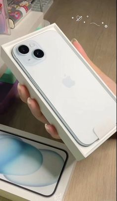 someone is holding an iphone case in their hand and it's inside the box