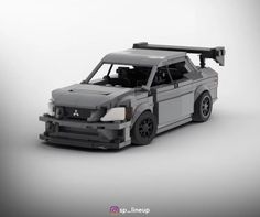 a car made out of legos is shown in this studio photo, with the hood up