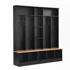 an empty black locker with wooden shelves