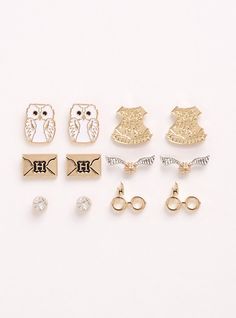 six pairs of earrings are shown in different shapes and sizes, including one with the letter h