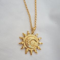 "This hammered coin pendant is edged in delicate polished radiating granulation, and features our dainty crescent Moon in the centre which is edged in delicate beading and has 3 tiny water droplets signifying the ocean being pulled by the moon. The perfect chunky gold pendant for everyday layering. Width of Coin: 2.5cm, 18\" medium round belcher chain with an adjuster at 16\" 18ct yellow gold plated silver" Gold Pendant Jewelry Turkish, Bohemian Crescent Hammered Jewelry, Gold Coin, Water Droplets, Letter Necklace, Dream Jewelry, Coin Pendant, Gold Coins, Pretty Jewellery