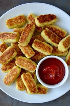 there are several pieces of bread with ketchup on the plate