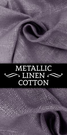 metallic linen cotton fabric with black and white lettering on the bottom, in front of an image