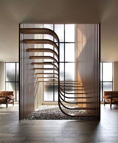 a spiral staircase in the middle of a living room