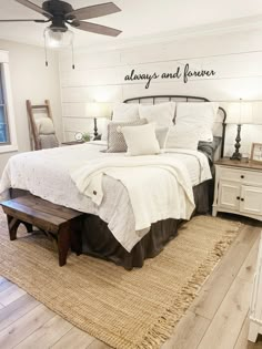 a bedroom with a bed, dresser and ceiling fan in the corner that reads sleep tight