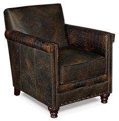 a brown leather chair with studded arms