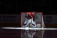 an ice hockey goalie is waiting for the puck