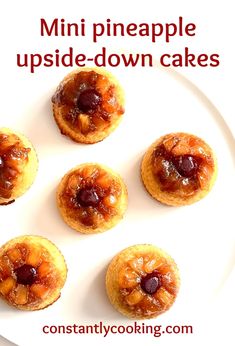 mini pineapple upside down cakes on a white plate with text overlay that reads, mini pineapple upside down cakes