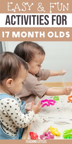 two toddlers playing with letters and numbers on a table