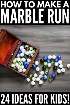 a wooden box filled with marbles on top of a table