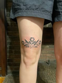 a person with a tattoo on their leg