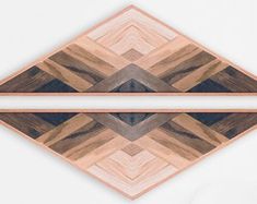 two pieces of wood are arranged in the shape of a diamond