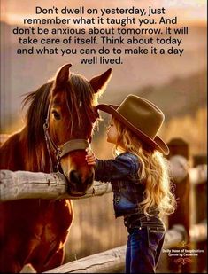 a girl is petting a horse with a cowboy hat on it's head