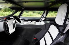 the interior of a car with black and white seats