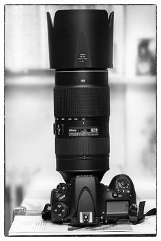 a large camera lens sitting on top of a table