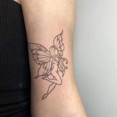 a woman's arm with a small tattoo on the side of her body and a flower