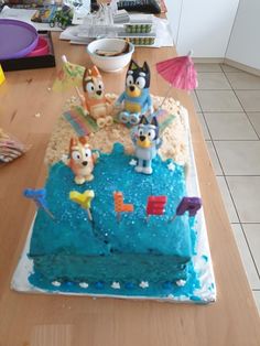 a birthday cake with cartoon characters on it