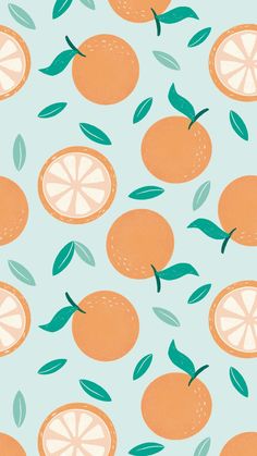 an orange pattern on a blue background with green leafy stems and two whole oranges