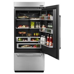 an open refrigerator with its door wide open and food in the freezer compartment, on a white background