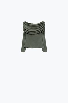 Step into spring with our trendy Bodycon Off Shoulder Top in Green Khaki. This top is designed to accentuate your figure with its bodycon fit, while the off-the-shoulder boat neckline adds a touch of romantic allure. Made from a blend of 95% viscose and 5% elastane, it offers a comfortable stretch and a lightweight feel, perfect for those warmer days. The ruched details add a stylish twist, making this top a must-have for any fashion-forward wardrobe. Model Info: Model is wearing size S. Model's Skirt Jumpsuit, Off Shoulder Top, Scarf Hat, Boat Neckline, Green And Khaki, Swim Accessories, Off Shoulder Tops, Swimsuit Cover