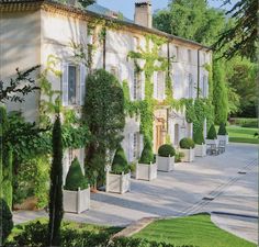 an image of a house that is surrounded by trees and bushes, with the words lavenderhill interiors on it