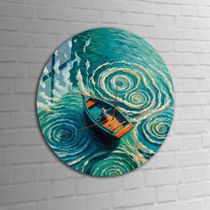 a clock with a painting of a boat in the ocean on it's side