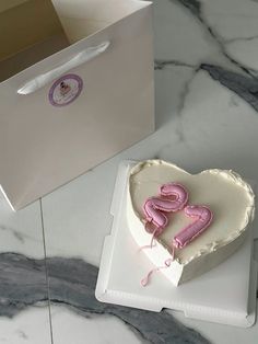 a heart shaped cake sitting on top of a table