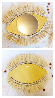 two pictures of an eye shaped mirror made out of brooms