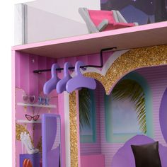 a barbie doll house with furniture and accessories in the playroom, including a bed