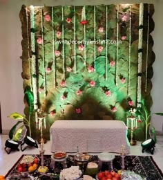 a table topped with lots of food next to a wall