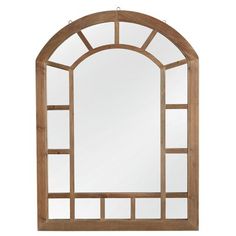 an arched wooden mirror on a white background