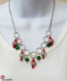 This festive 18 inch necklace features hanging Christmas ornaments, providing sparkle when you move! This would make a great Christmas gift or purchase for yourself for your holiday gala event. Holiday Party Silver Necklaces, Holiday Party Silver Necklace, Handmade Christmas Necklaces For Festive Occasions, Festive Red Christmas Necklaces, Silver Holiday Necklaces For Festive Occasion, Silver Holiday Necklace For Festive Occasion, Silver Necklace For Christmas Celebration, Silver Christmas Party Necklace, Handmade Silver Necklace For Christmas