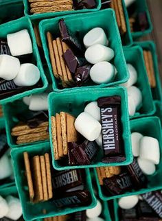 several trays filled with marshmallows and chocolate