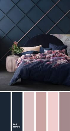 a bedroom with dark blue walls and pink bedding