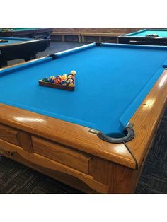 a pool table with blue cloth on it