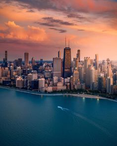 an aerial view of the chicago skyline at sunset