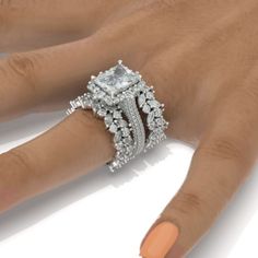 a woman's hand with an engagement ring on it