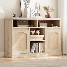 an entertainment center with speakers and books on it