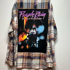 a plaid shirt with an image of prince rain on it