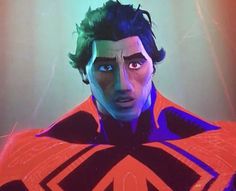 an animated image of a man in a red cape with black hair and blue eyes