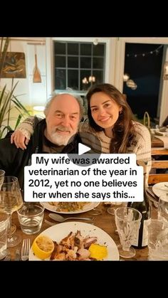 a man and woman sitting at a table with food in front of them, text reads my wife was awarded veterinan of the year in 2012