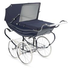 a baby carriage with an umbrella attached to it