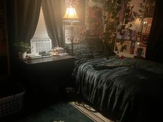 a bed room with a neatly made bed next to a window and a lamp on top of it