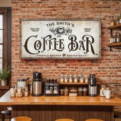 a coffee bar with wooden stools and brick wall in the background, there is a sign that says the smith's coffee bar