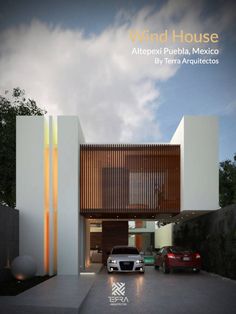 a car is parked in front of a modern house with wooden slats on the side