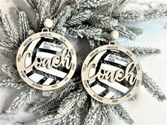 two christmas ornaments with the words coach on them