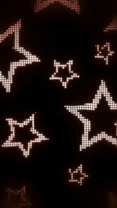 several white stars are arranged in the dark