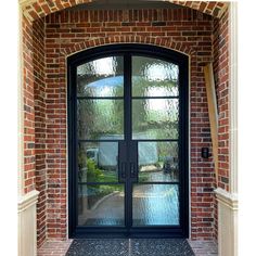 4 lite french iron double door with eyebrow arched top Double French Door, Arched Entry Doors, French Double Doors, Steel French Doors, Double Doors Exterior, Steel Front Door, Iron Entry Doors, Arched Eyebrows, Door Sweep