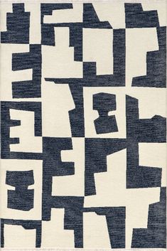 an abstract rug with black and white shapes